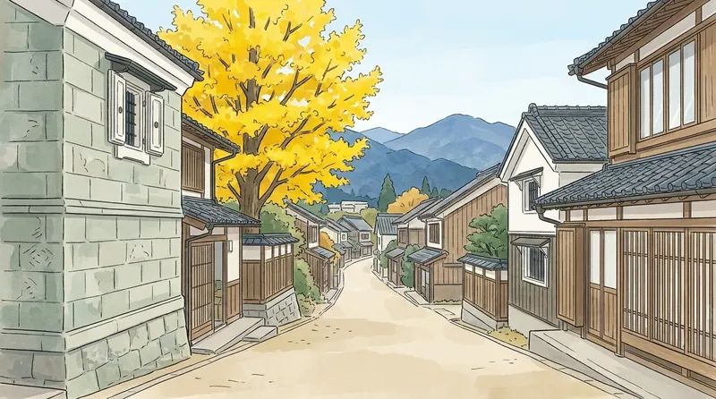 栃木県の住宅地のイメージの挿絵。灰緑色の石を積んだ蔵が並ぶ通りと、黄色く色づいたいちょう、遠くの青い山を描いたもの
